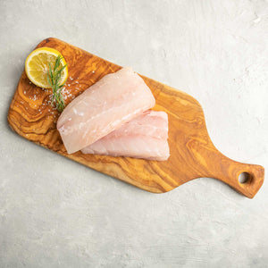 Red Snapper Fillets garnished on cutting board by FishFinery